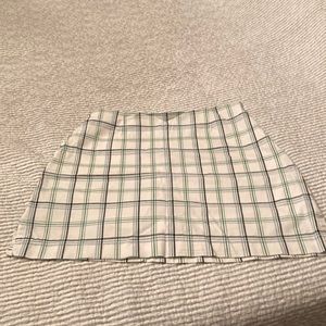 Size 10 Golf skort, white, Kelly green, and navy plaid.